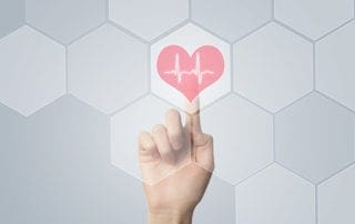 Doctor using modern computer for cardiac health