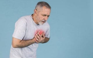 senior man having chest pains